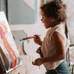 Canvas Painting - A Young Girl Looking at Her Artwork