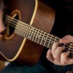 Guitar Strings - Person Playing Brown Guitar