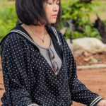 Yoga Meditation - Woman Sitting Outside with Eyes Closed and Meditating