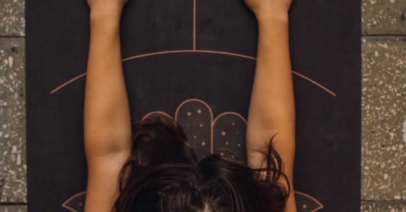 Pilates Exercise - Overhead Shot of a Woman Meditating