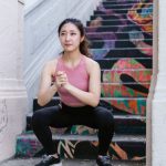 Calisthenics Training - Woman Squatting Beside the Stairs
