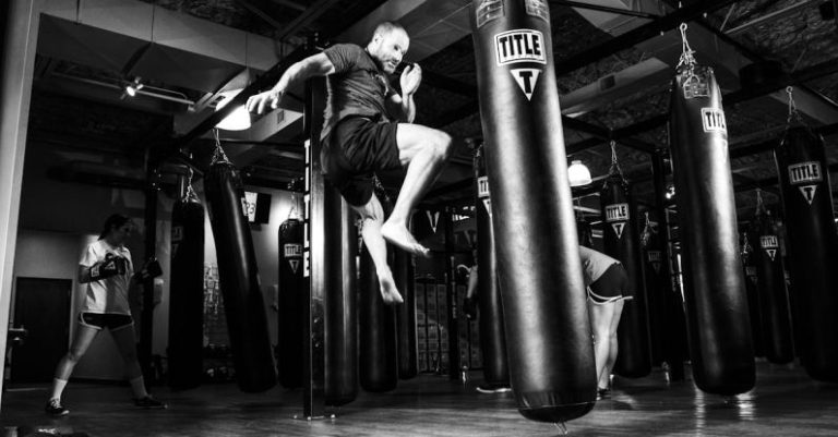 Martial Arts - Man Kicking Heavy Bag