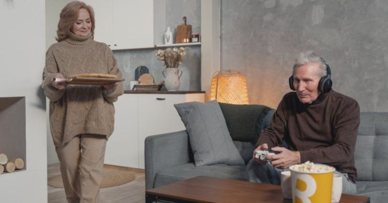 Video Games - Woman Serving Food to a Gamer