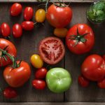 Nutrition Myths - Multicolored Tomatoes Lying on a Wooden Tray