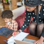 Working Mother - Mother and Child Sitting at the Table