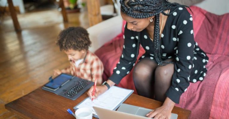 Working Mother - Mother and Child Sitting at the Table