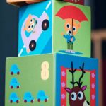 Child Play - Person Holding Yellow and Pink Lego Blocks