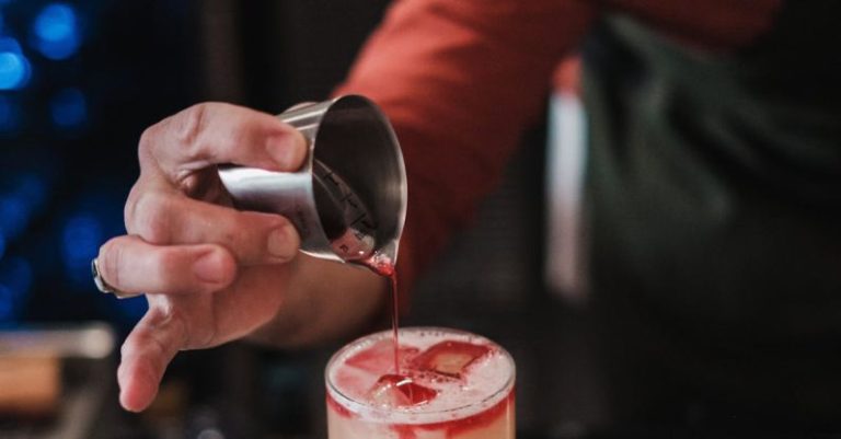 Retirement Preparation - A bartender pouring a drink into a glass