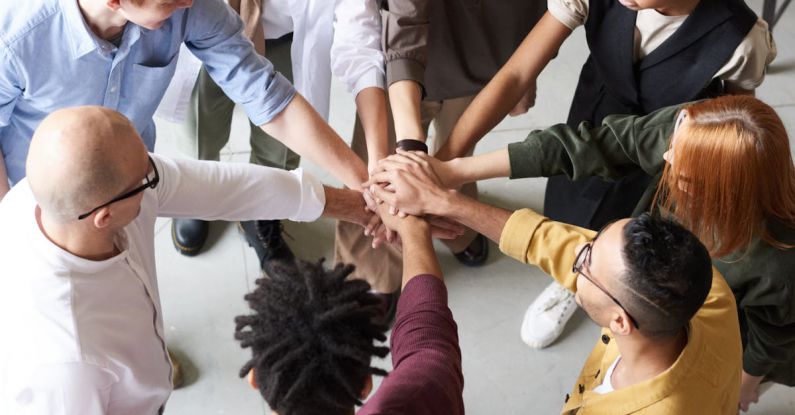 Diversity Workplace - Photo Of People Holding Each Other's Hands