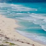 Caribbean Sea - A view of the beach and ocean from a car