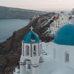 Santorini Sunset - White and Blue Concrete Building Near Body of Water