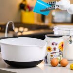 AI Advancement - Gray and White Robot Holding Plastic Cup