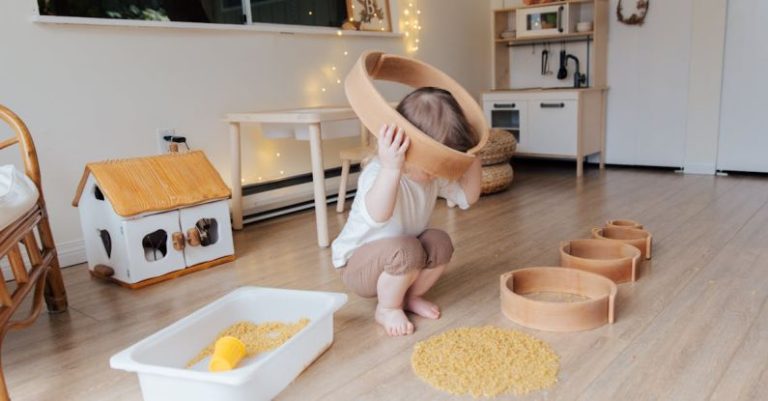 Gluten-free Pasta - Full length of anonymous toddler squatting barefoot on floor playing with round wooden shapes of different size and pasta and putting biggest shape on while developing fine motor skills at home
